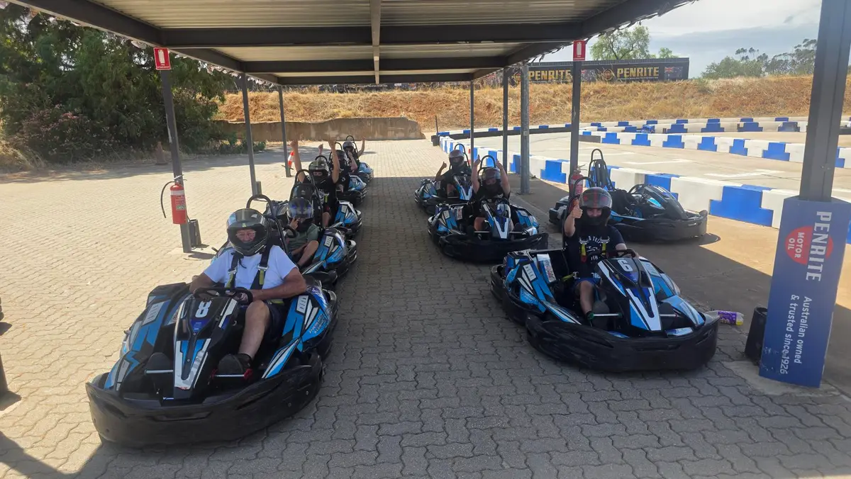 NDIS participants go-karting together on a community access outing in South Australia